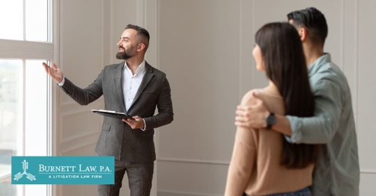 couple talking to a real estate agent